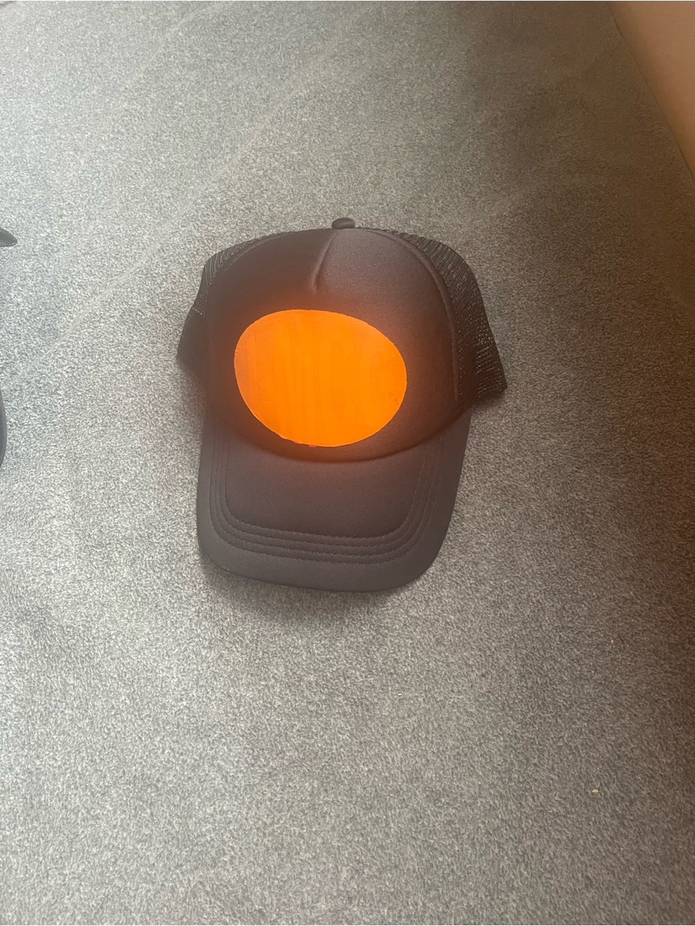 Black Trucker Hat with Bright Orange Patch